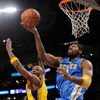 LOS ANGELES, CA - MAY 27:  Nene #31 of the Denver Nuggets goes up for a shot against Lamar Odom #7 of the Los Angeles Lakers in Game Five of the Western Conference Finals during the 2009 NBA Playoffs at Staples Center on May 27, 2009 in Los Angeles, Calif