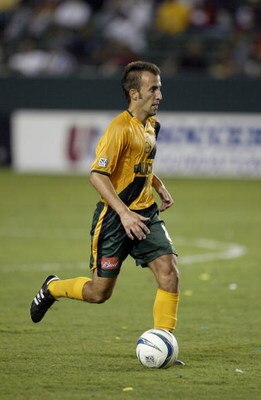 CARSON, CA - AUGUST 30:  Midfielder Peter Vagenas #8 of the Los Angeles Galaxy dribbles the ball during the game against the Dallas Burn at the Home Depot Center on August 30, 2003 in Carson, California. The Galaxy defeated the Burn 2-1. (Photo by Jeff Gr
