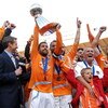 WASHINGTON - NOVEMBER 18:  Wade Barrett #24 of the Houston Dynamo holds up the trophy in celebration with his team after defeating the New England Revolution by a score of 2-1 to win the 2007 Major League Soccer Cup at RFK Stadium on November 18, 2007 in 