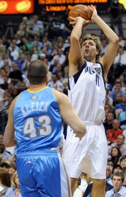 DALLAS - MAY 11:  Forward Dirk Nowitzki #41 of the Dallas Mavericks takes a shot against Linas Kleiza #43 of the Denver Nuggets in Game Four of the Western Conference Semifinals during the 2009 NBA Playoffs at American Airlines Center on May 11, 2009 in D