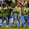 SEATTLE - MARCH 28:  Nate Jaqua #21 of the Seattle Sounders FC celebrates with the team after scoring a goal in the first half during the match against Real Salt Lake on March 28, 2009 at Qwest Field in Seattle, Washington. (Photo by Otto Greule Jr/Getty 