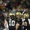 NASHVILLE, TN - DECEMBER 31:  Larry Smith #10 of the Vanderbilt Commodores celebrates against the Boston College Eagles during the Gaylord Hotels Music City Bowl at LP Field on December 31, 2008 in Nashville, Tennessee.  (Photo by Andy Lyons/Getty Images)