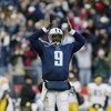 NASHVILLE, TN - NOVEMBER 17:  Steve McNair #9 of the Tennessee Titans gestures on the field during the game against the Pittsburgh Steelers at The Coliseum on November 17, 2002 in Nashville, Tennessee.  The Titans won the game 31-23.  (Photo by Andy Lyons