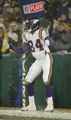 GREEN BAY, WI - JANUARY 9:  Wide receiver Randy Moss #84 of the Minnesota Vikings pretends to pull his pants down and moon the crowd after scoring a touchdown in the second half against the Green Bay Packers in the NFC wild-card game at Lambeau Field Janu