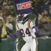 GREEN BAY, WI - JANUARY 9:  Wide receiver Randy Moss #84 of the Minnesota Vikings pretends to pull his pants down and moon the crowd after scoring a touchdown in the second half against the Green Bay Packers in the NFC wild-card game at Lambeau Field Janu