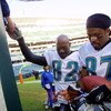 09 Dec 2001 : Keenan McCardell #87 and Jimmy Smith #82 of the Jacksonville Jaguars sign autographs after the game against the Cincinnati Bengals at Paul Brown Stadium in Cincinnati, Ohio. The Jaguars won 14-10. DIGITAL IMAGE. Mandatory Credit : Tom Pidgeo