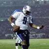 OAKLAND, CA - JANUARY 19:  Quarterback Steve McNair #9 of the Tennessee Titans scores in the third quarter of the AFC Championship game against the Oakland Raiders at Network Associates Coliseum on January 19, 2003 in Oakland, California.  The Raiders def