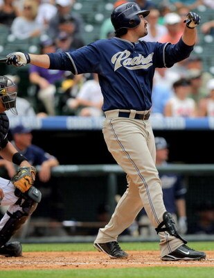 DENVER - MAY 31:  Adrian Gonzalez #23 of the San Diego Padres watches his third inning three run homerun off of starting pitcher Jorge De La Rosa of the Colorado Rockies during MLB action at Coors Field on May 31, 2009 in Denver, Colorado.  (Photo by Doug