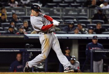 NEW YORK - MAY 04:  Jason Bay #44 of the Boston Red Sox hits a two-run home run in the seventh inning against the New York Yankees on May 4, 2009 at Yankee Stadium in the Bronx borough of New York City.  (Photo by Jim McIsaac/Getty Images)