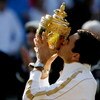 WIMBLEDON, ENGLAND - JULY 05:  Roger Federer of Switzerland kisses the trophy after victory during the men's singles final match against Andy Roddick of USA on Day Thirteen of the Wimbledon Lawn Tennis Championships at the All England Lawn Tennis and Croq