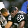OAKLAND, CA - SEPTEMBER 11: Offensive Line back Isaiah Ekejiuba #50 of the Oakland Raiders sits in the sidelines during a game against the San Diego Chargers at McAfee Coliseum on September 11, 2006 in Oakland, California. (Photo by Jed Jacobsohn/Getty Im