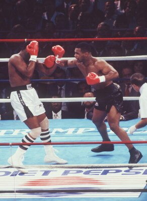 27 JUN 1988:  HEAVYWEIGHT CHAMPION MIKE TYSON THROWS A RIGHT AT CHALLENGER MICHAEL SPINKS DURING THEIR HEAVYWEIGHT TITLE FIGHT IN ATLANTIC CITY, NEW JERSEY.  TYSON STOPPED SPINKS WITH A KNOCK OUT IN THE FIRST ROUND, WINNING THE FIGHT IN 91 SECONDS TO RETA