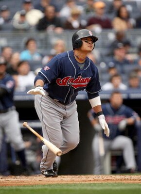 NEW YORK - APRIL 19:  Shin-soo Choo #17 of the Cleveland Indians hits a home run in the second inning of their game against the New York Yankees at Yankee Stadium on April 19, 2009 in the Bronx borough of New York City.  (Photo by Ezra Shaw/Getty Images)