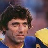 Quarterback Joe Namath of the LA Rams smiles during a game at the LA Memorial Coliseum in Los Angeles, California.