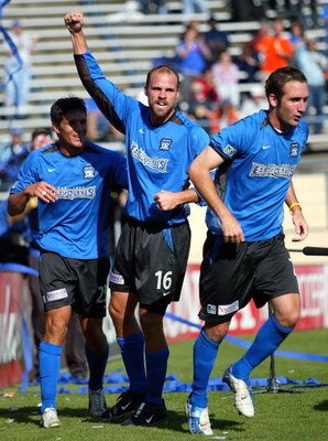 SAN JOSE, CA - OCTOBER 24:  Defender Craig Waibel #16 of the San Jose Earthquakes celebrates with teammates Brian Ching #25 (L) and Ian Russell #7 (R) after scoring against the Kansas City Wizards in game one of the MLS Western Conference semifinals on Oc