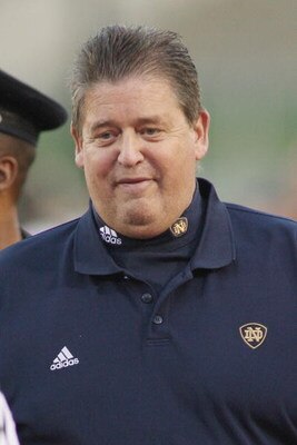 LOS ANGELES - NOVEMBER 29:  Head coach Charlie Weis of the Notre Dame Fighting Irish smiles as he walks to the locker room from the field before the game against the USC Trojans on November 29, 2008 at the Los Angeles Memorial Coliseum in Los Angeles, Cal
