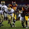 LOS ANGELES, CA - NOVEMBER 29:  C.J. Gable #2 of the USC Trojans tries to break from the Notre Dame Fighting Irish defense during the quarter at the Coliseum on November 29, 2008 in Los Angeles, California.  (Photo by Harry How/Getty Images)