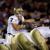 LOS ANGELES, CA - NOVEMBER 29:  Jimmy Clausen #7 of the Notre Dame Fighting Irish calls a play against the USC Trojans during the game at the Coliseum on November 29, 2008 in Los Angeles, California.  (Photo by Harry How/Getty Images)