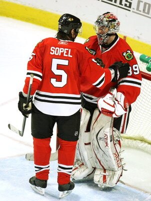 CHICAGO - MARCH 19: Brent Sopel #5 of the Chicago Blackhawks congratulates teammate Nikolai Khabibulin #39 after Khabibulin shut out the Washington Capitals on March 19, 2008 at the United Center in Chicago, Illinois. (Photo by Jonathan Daniel/Getty Image