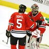 CHICAGO - MARCH 19: Brent Sopel #5 of the Chicago Blackhawks congratulates teammate Nikolai Khabibulin #39 after Khabibulin shut out the Washington Capitals on March 19, 2008 at the United Center in Chicago, Illinois. (Photo by Jonathan Daniel/Getty Image