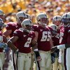 CHESTNUT HILL, MA - SEPTEMBER 20:  Dominique Davis #15 of the Boston College Eagles talks in the huddle against the Central Florida Knights as teammates Matt Tennant #65 and Brandon Robinson #2 stand on September 20, 2008 at Alumni Stadium in Chestnut Hil