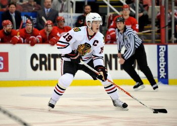 DETROIT - MAY 17:  Jonathan Toews #19  of the Chicago Blackhawks skates with the puck against the Detroit Red Wings during Game One of the Western Conference Championship Round of the 2009 Stanley Cup Playoffs on May 17, 2009 at Joe Louis Arena in Detroit