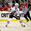 DETROIT - MAY 17:  Jonathan Toews #19  of the Chicago Blackhawks skates with the puck against the Detroit Red Wings during Game One of the Western Conference Championship Round of the 2009 Stanley Cup Playoffs on May 17, 2009 at Joe Louis Arena in Detroit
