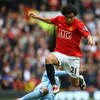 MANCHESTER, ENGLAND - MAY 10:  Rafael of Manchester United hurdles the tackle of Robinho of Manchester City during the Barclays Premier League match between Manchester United and Manchester City at Old Trafford on May 10, 2009 in Manchester, England.  (Ph