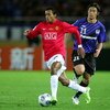 YOKOHAMA, JAPAN - DECEMBER 18: Akira Kaji  of Gamba Osaka and Nani of Manchester United compete for the ball during the FIFA Club World Cup Japan 2008 semi final match between Gamba Osaka and Manchester United at the International Stadium Yokohama on Dece