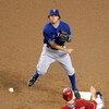 PHOENIX - JUNE 23:  Infielder Ian Kinsler #5 of the Texas Rangers throws over the sliding Mark Reynolds #27 of the Arizona Diamondbacks to complete a double play during the major league baseball game at Chase Field on June 23, 2009 in Phoenix, Arizona.   