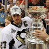 DETROIT - JUNE 12:  Sidney Crosby #87 of the Pittsburgh Penguins celebrates with the Stanley Cup after defeating the Detroit Red Wings by a score of 2-1 to win Game Seven and the 2009 NHL Stanley Cup Finals at Joe Louis Arena on June 12, 2009 in Detroit, 