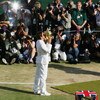 LONDON - JULY 08:  Roger Federer of Switzerland lifts the trophy in front of photographers as he celebrates victory following the Men's Singles final match against Rafael Nadal of Spain during day thirteen of the Wimbledon Lawn Tennis Championships at the