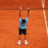 PARIS - JUNE 07:  Roger Federer of Switzerland celebrates victory during the Men's Singles Final match against Robin Soderling of Sweden on day fifteen of the French Open at Roland Garros on June 7, 2009 in Paris, France.  (Photo by Clive Brunskill/Getty 