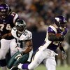 MINNEAPOLIS - JANUARY 4:   Adrian Peterson #28 of the Minnesota Vikings runs past Quentin Mikell #27 of the Philadelphia Eagles during the NFC Wild Card playoff game on January 4,2009 at the Hubert H. Humphrey Metrodome in Minneapolis, Minnesota. (Photo b