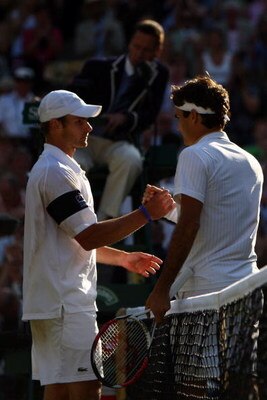 WIMBLEDON, ENGLAND - JULY 05:  Roger Federer of Switzerland shakes hands with Andy Roddick of USA after the men's singles final match on Day Thirteen of the Wimbledon Lawn Tennis Championships at the All England Lawn Tennis and Croquet Club on July 5, 200