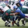 EAST RUTHERFORD, NJ - DECEMBER 07:  Justin Tuck #91 of the New York Giants tackles Brian Westbrook #36 of the Philadelphia Eagles on December 7, 2008 at Giants Stadium in East Rutherford, New Jersey.  (Photo by Al Bello/Getty Images)