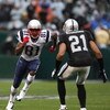 OAKLAND, CA - DECEMBER 14:  Randy Moss #81 of the New England Patriots runs against Nnamdi Asomugha #21 of the Oakland Raiders during an NFL game on December 14, 2008 at the Oakland-Alameda County Coliseum in Oakland, California.  (Photo by Jed Jacobsohn/