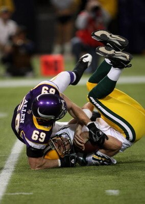 MINNEAPOLIS - NOVEMBER 09:  Defensive end Jared Allen #69 of the Minnesota Vikings sacks quarterback Aaron Rodgers #12 of the Green Bay Packers on November 9, 2008 at the Metrodome in Mineapolis, Minnesota.  (Photo by Stephen Dunn/Getty Images)