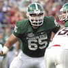 ORLANDO, FL - JANUARY 1: Center Joel Nitchman #65 of the Michigan State Spartans sets to block against the Georgia Bulldogs at the 2009 Capital One Bowl at the Citrus Bowl on January 1, 2009 in Orlando, Florida.  (Photo by Al Messerschmidt/Getty Images) 