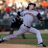 OAKLAND, CA - JUNE 23:  Tim Lincecum #55 of the San Francisco Giants pitches against the Oakland Athletics during a Major League Baseball game on June 23, 2009 at the Oakland Coliseum in Oakland, California.  (Photo by Jed Jacobsohn/Getty Images)