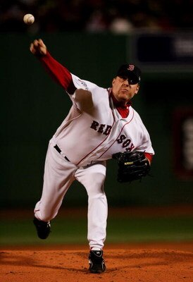 BOSTON - OCTOBER 25:  Curt Schilling #38 of the Boston Red Sox pitches against the Colorado Rockies during Game Two of the 2007 Major League Baseball World Series at Fenway Park on October 25, 2007 in Boston, Massachusetts.  (Photo by Jim McIsaac/Getty Im
