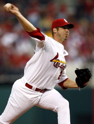 ST. LOUIS, MO - APRIL 1:  Starting pitcher Chris Carpenter #29 of the St. Louis Cardinals throws against the New York Mets in their Opening Day game on April 1, 2007 at Busch Stadium in St. Louis, Missouri.  (Photo by Dilip Vishwanat/Getty Images)