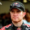 DAYTONA BEACH, FL - JULY 02: Brian Vickers, driver of the #83 Red Bull Toyota, stands in the garage during practice for the NASCAR Sprint Cup Series Coke Zero 400 at Daytona International Speedway on July 2, 2009 in Daytona Beach, Florida.  (Photo by Jerr