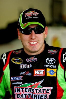 DAYTONA BEACH, FL - JULY 02:  Kyle Busch, driver of the #18 Interstate Batteries Toyota, waits in the garage during practice for the NASCAR Sprint Cup Series Coke Zero 400 at Daytona International Speedway on July 2, 2009 in Daytona Beach, Florida.  (Phot