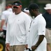 BOURBONNAIS, IL - JULY 27: Defensive coordinator Ron Rivera (L) and head coach Lovie Smith of the Chicago Bears talk during the first summer training camp practice on July 27, 2006 at Olivet Nazarene University in Bourbonnais, Illinois. (Photo by Jonathan
