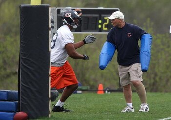 LAKE FOREST, IL - MAY 01: Defensive line coach Rob Marinelli of the Chicago Bears, former head coach of the Detroit Lions, works with Jarron Gilbert #73 during a rookie mini-camp practice on May 1, 2009 at Halas Hall in Lake Forest, Illinois. (Photo by Jo