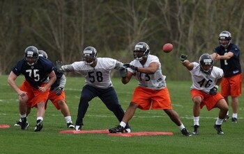 LAKE FOREST, IL - MAY 01: (L-R) Dave Peck #75, Marcus Freeman #58, Jarron Gilbert#73 and Al Afalava #46 of the Chicago Bears participate in a special teams drill during a rookie mini-camp practice on May 1, 2009 at Halas Hall in Lake Forest, Illinois.  (P