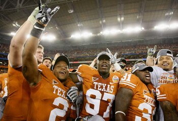 GLENDALE, AZ - JANUARY 05:  (L-R) Vondrell McGee #2, Russell Carter #97 and Cody Johnson #31 of the Texas Longhorns celebrate after defeating the Ohio State Buckeyes in the Tostitos Fiesta Bowl Game on January 5, 2009 at University of Phoenix Stadium in G