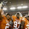 GLENDALE, AZ - JANUARY 05:  (L-R) Vondrell McGee #2, Russell Carter #97 and Cody Johnson #31 of the Texas Longhorns celebrate after defeating the Ohio State Buckeyes in the Tostitos Fiesta Bowl Game on January 5, 2009 at University of Phoenix Stadium in G