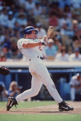 19 May 1996:  Outfielder Todd Hollandsworth of the Los Angeles Dodgers focuses on the baseball as he watches for the result of a hit while following through on a swing during an at-bat in the Dodgers 5-4 loss to the Philadelphia Phillies at Dodger Stadium